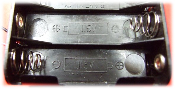 FreX PFA-7 Battery compartment displaying battery polarity instructions. 